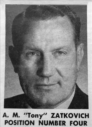 Close head shot portrait of a man in suit and tie with the words "Position number four" below their name