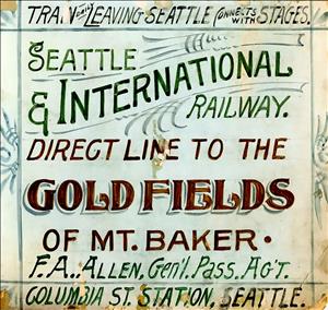 Handwritten handbill says Seattle and international railway direct line to the gold fields of mount baker. 