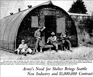 Newspaper photo of soldiers sitting and standing in front of a rounded, prefabricated barracks