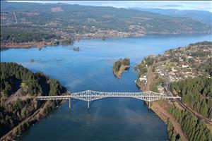 Aerial view of suspension bridge spanning broad river