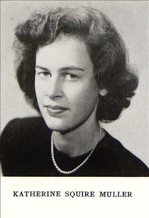 A head and shoulders portrait of a young white woman with styled wavy hair wearing white pearls. 