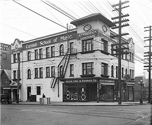 An early 20th century three story building on a street corner