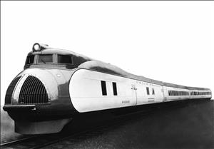 A train locomotive that looks very modern and streamlined pulls two passenger cars with a similar appearance. 