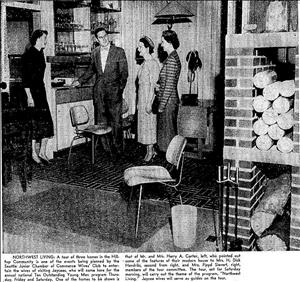Newspaper clipping shows three women in dresses talking to a man in a suit inside a modern home. Mid century chairs, light fixtures and chimney are visible. 