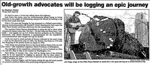Newspaper headline shows a man with a guitar standing on a flatbed next to a log