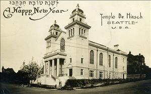 A large stone temple at the intersection of two streets. Lettering on the card is in Hebrew and English and says A Happy New Year Temple de Hirsch Seattle USA