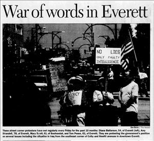 Newspaper article shows women holding protest signs