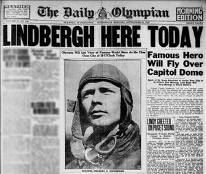 Newspaper headline of young man in aviator helmet with text that says Lindbergh Here Today Famous Hero Will Fly Over Capitol Building.