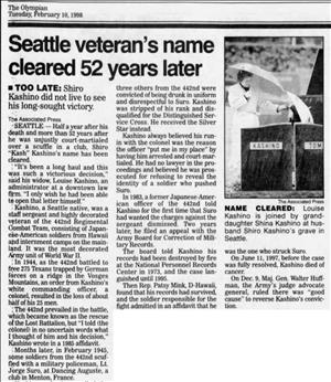 Newspaper headline says Seattle veteran's name cleared fifty two years later. 