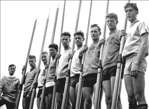 Photograph of eight oarsmen and coxswain Bob Mock of the Husky crew that won the gold medal at the 1936 Olympic Game