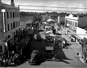 A parade down a small town street.