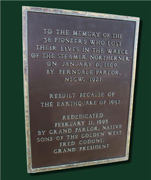  A brown plaque against a green background