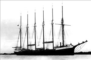 A large wooden ship with six masts. 